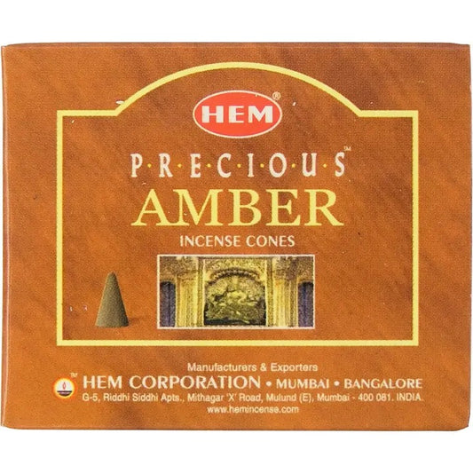 Box of HEM Precious Amber incense cones with branding and product details.