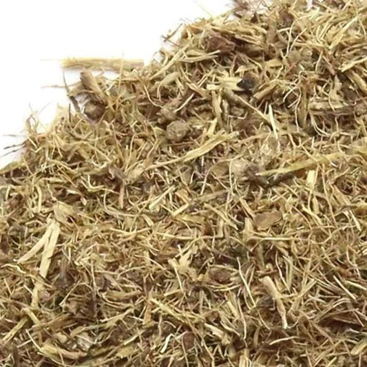 A close-up pile of dried, shredded brown and tan plant material or fiber against a white background.