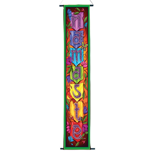 Decorative banner with colorful letters spelling 'Namasté' on a white background