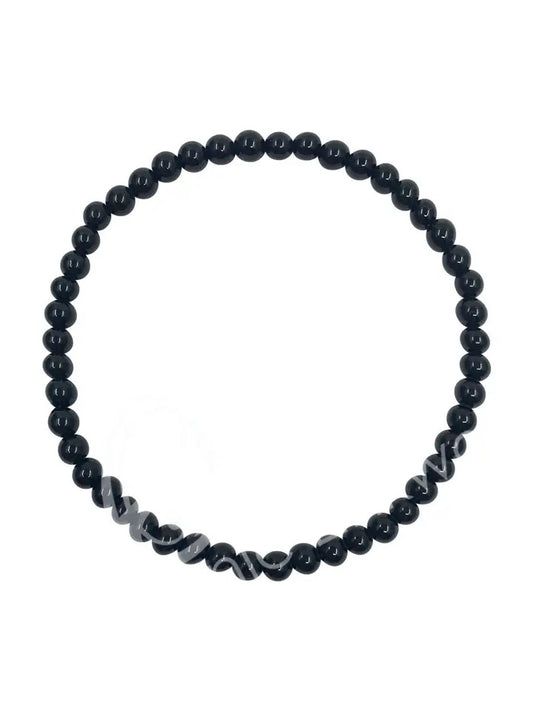 Black beaded bracelet on a white background