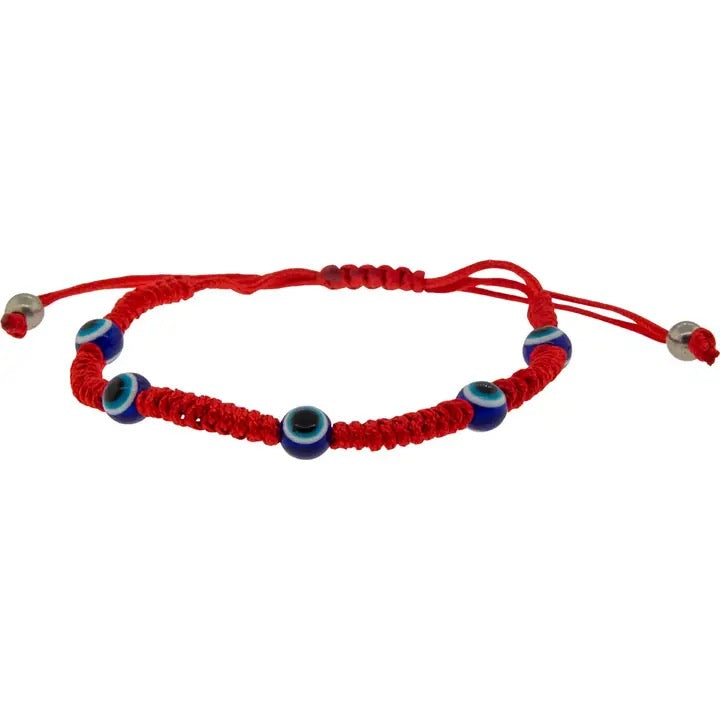 Red bracelet with blue and silver beads on a white background