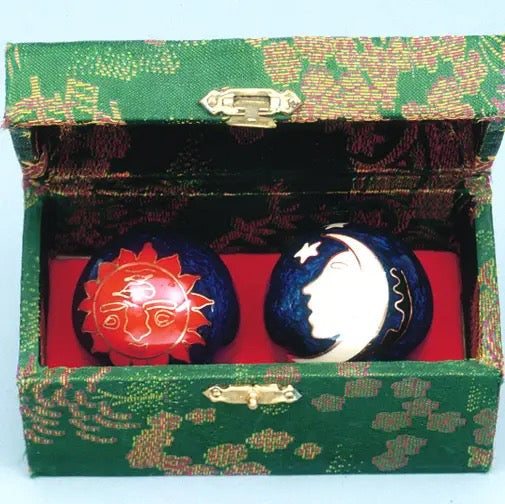 Sun & Moon Therapy Balls in a green box