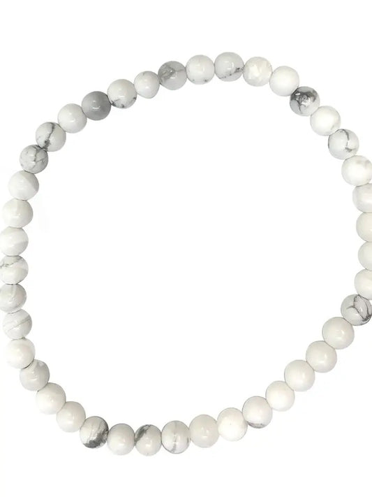White beaded bracelet on a white background