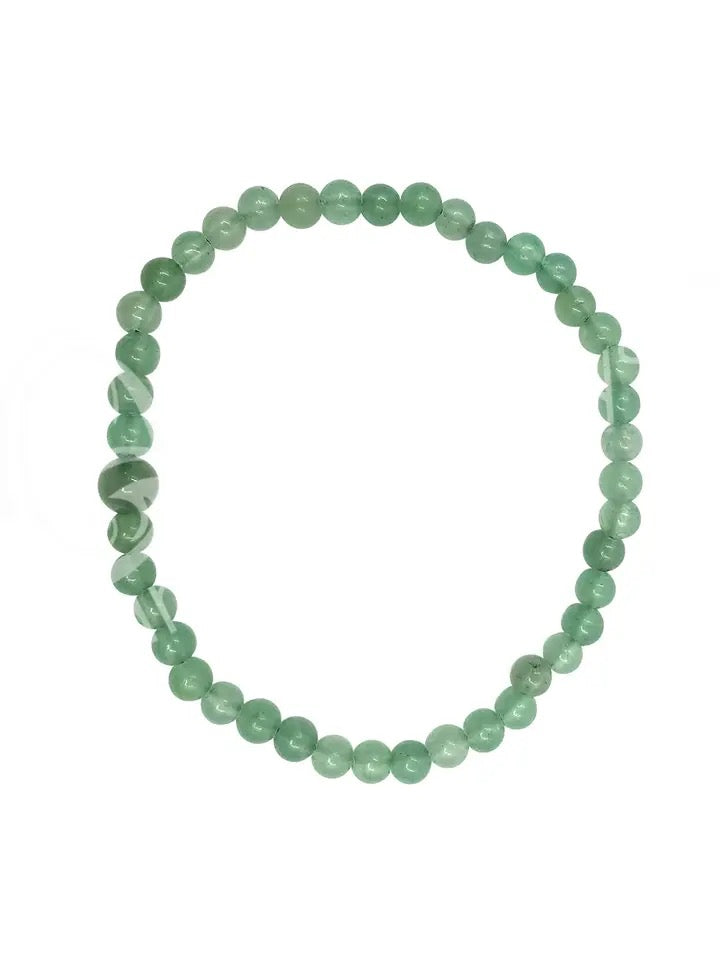 Green beaded bracelet on a white background
