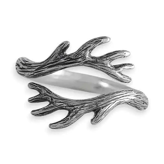 Silver antler-shaped ring on a white background