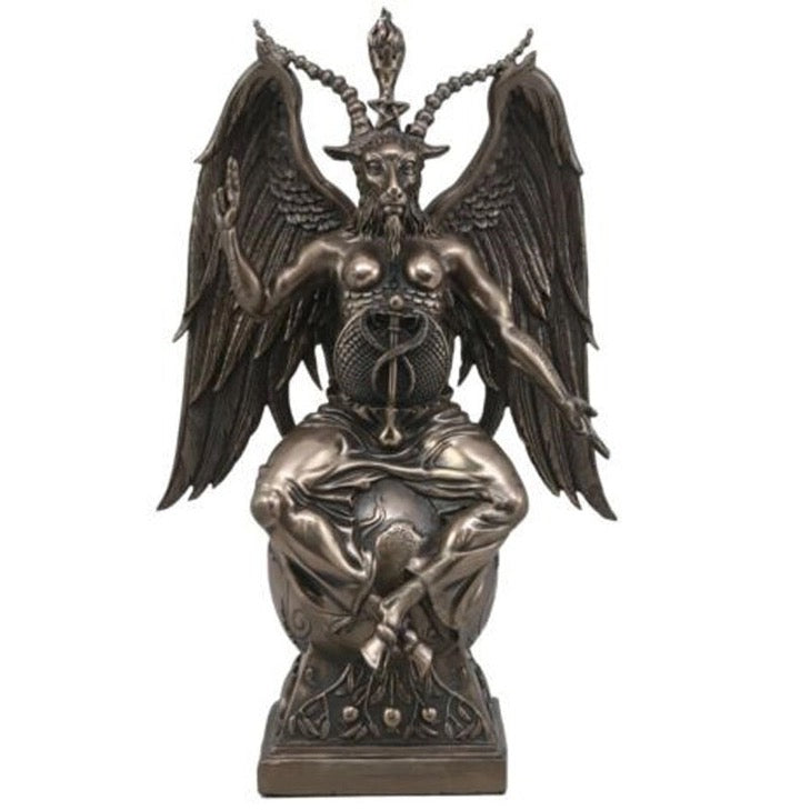 Bronze statue of a winged creature with a symbol on a white background