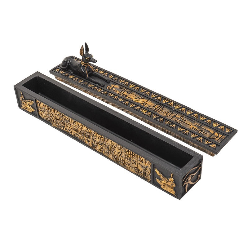 Decorative incense holder with Egyptian-themed design on a white background