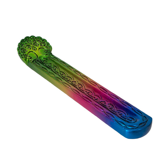 Multicolored incense burner with tree pattern on a white background
