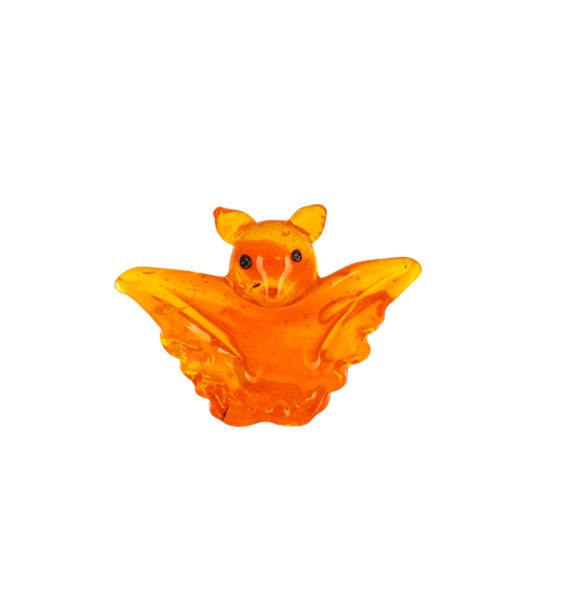 An orange translucent bat-shaped ornament or charm with small black eyes, shown against a plain white background.