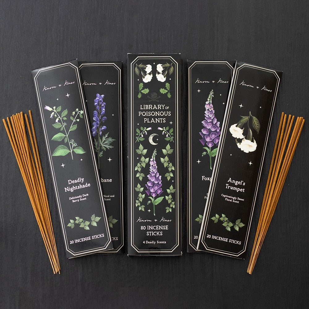 Incense sticks with decorative packaging on a dark background