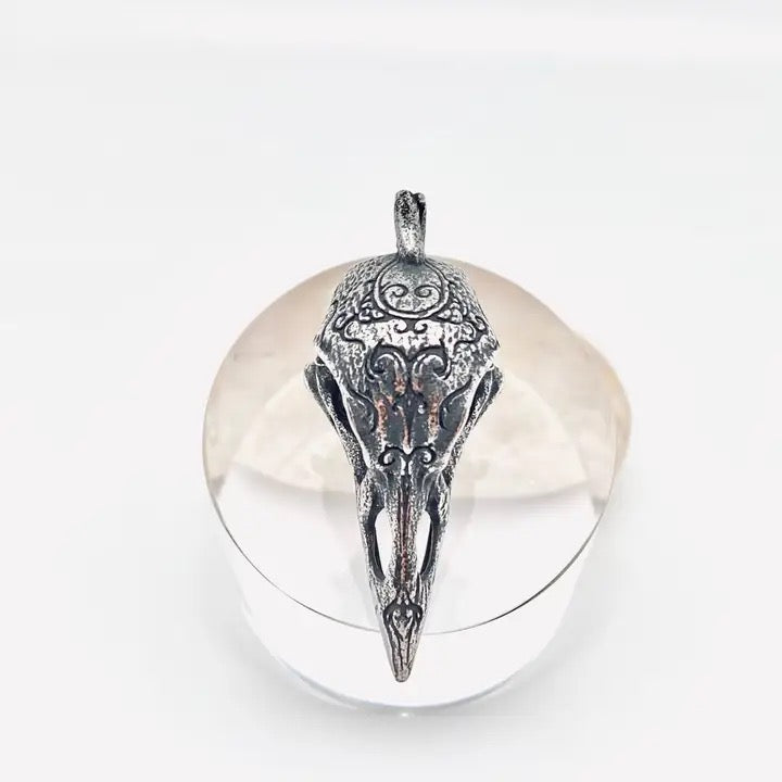 Silver pendant on a white background