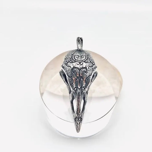 Silver pendant on a white background