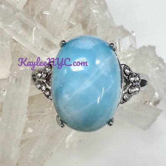 Ring with a large Larimar on a white background