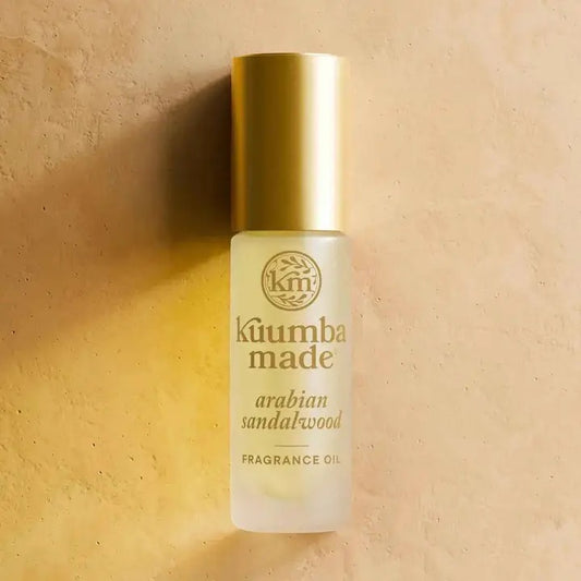 Kuumba Made Arabian Rose fragrance oil bottle on a beige background