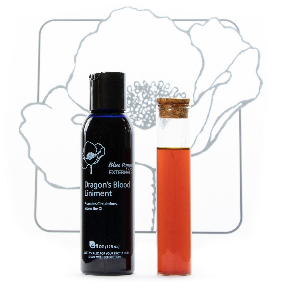 Bottle of Dragon's Blood Liniment with a corked container of red liquid on a white background