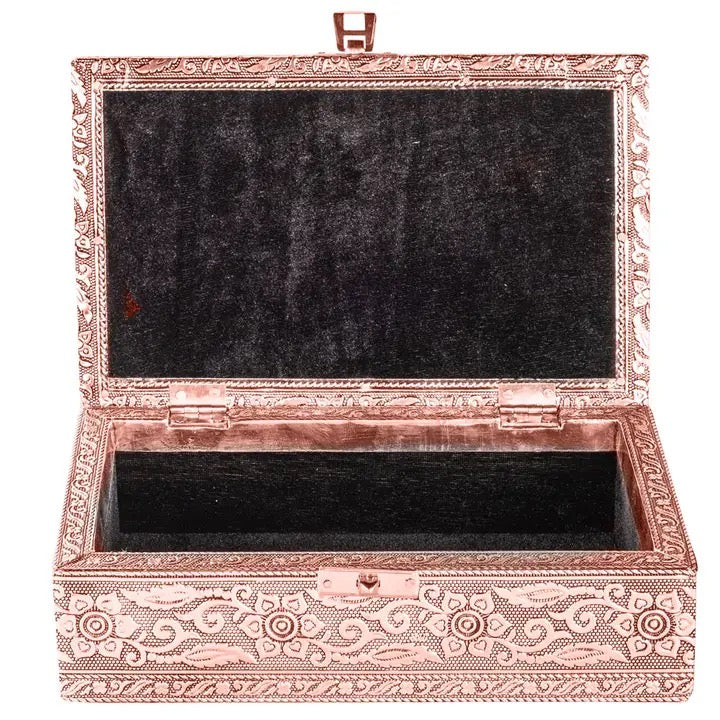 Decorative jewelry box with intricate patterns on a white background