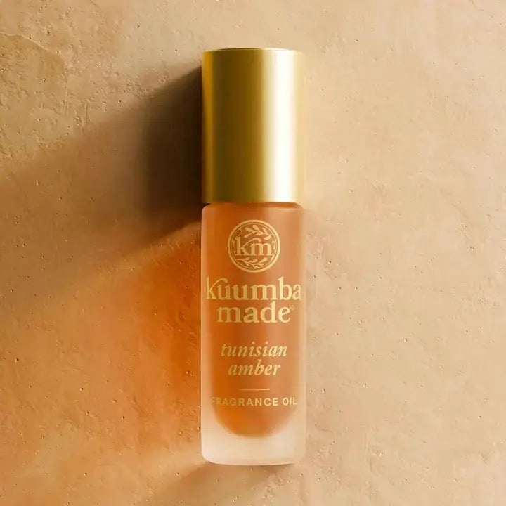 Köumba Made Tunisian Amber fragrance oil bottle on a beige background