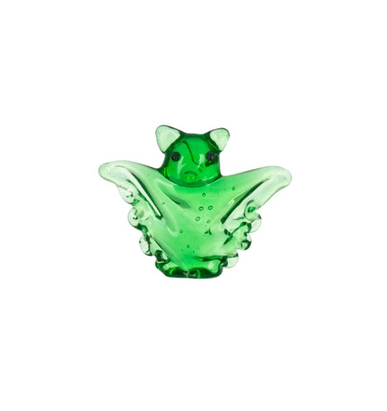 A small translucent green glass figurine shaped like a stylized bat or winged creature, centered on a plain white background.
