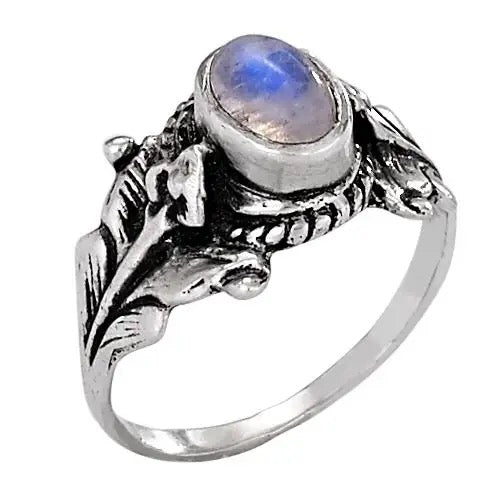Silver ring with a moonstone on a white background