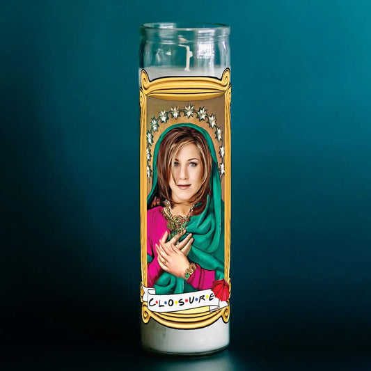 Candle with a portrait of a woman in a religious-style frame on a dark blue background