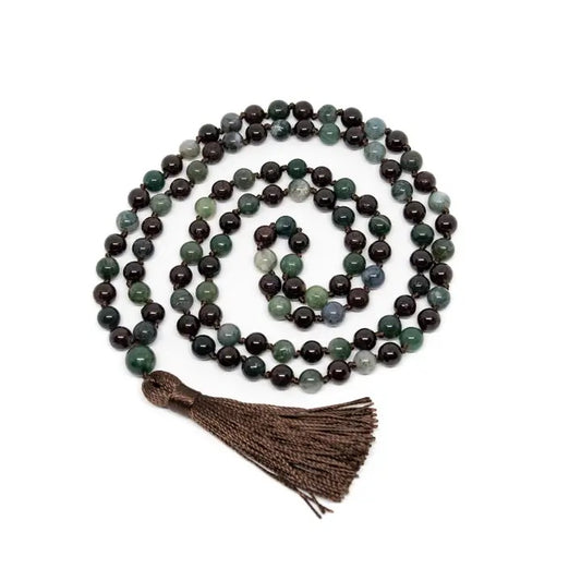 String of multicolored beads with a tassel on a white background