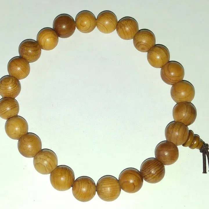 Wooden beaded bracelet on a white background