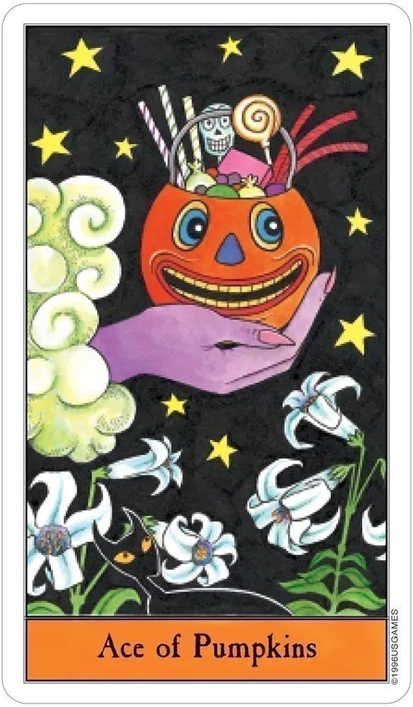 Card featuring a pumpkin with a face, surrounded by flowers and stars, labeled 'Ace of Pumpkins'.