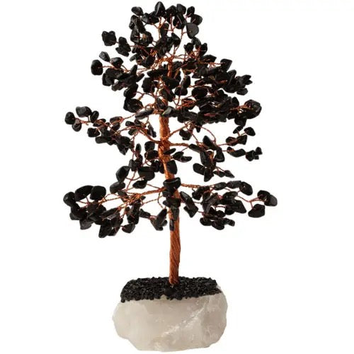 Decorative tree made of black stones on a white background