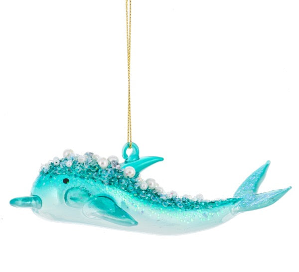 Decorative ornament of a turquoise dolphin with bubbles on a white background