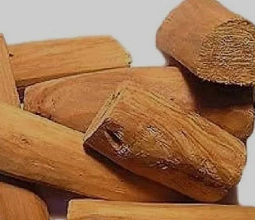 Stack of wooden sticks on a plain background