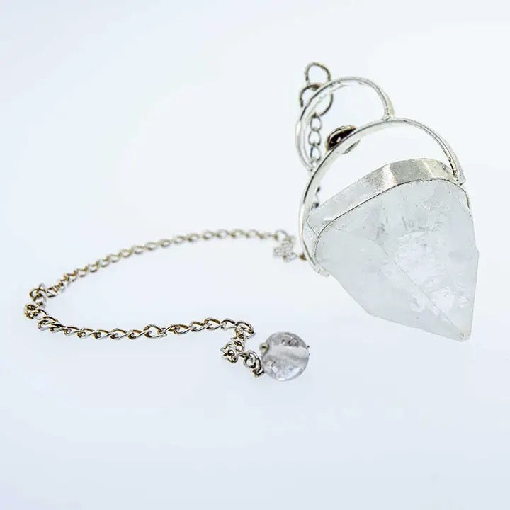 Crystal pendulum on a white background