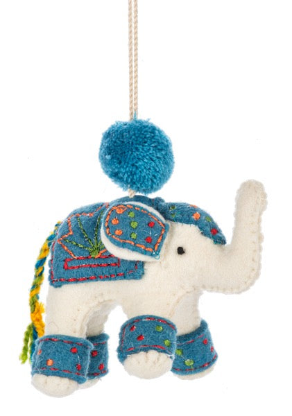 Decorative elephant ornament with a blue hat and colorful patterns on a white background