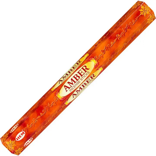 Pack of Amber incense sticks with decorative design on a white background