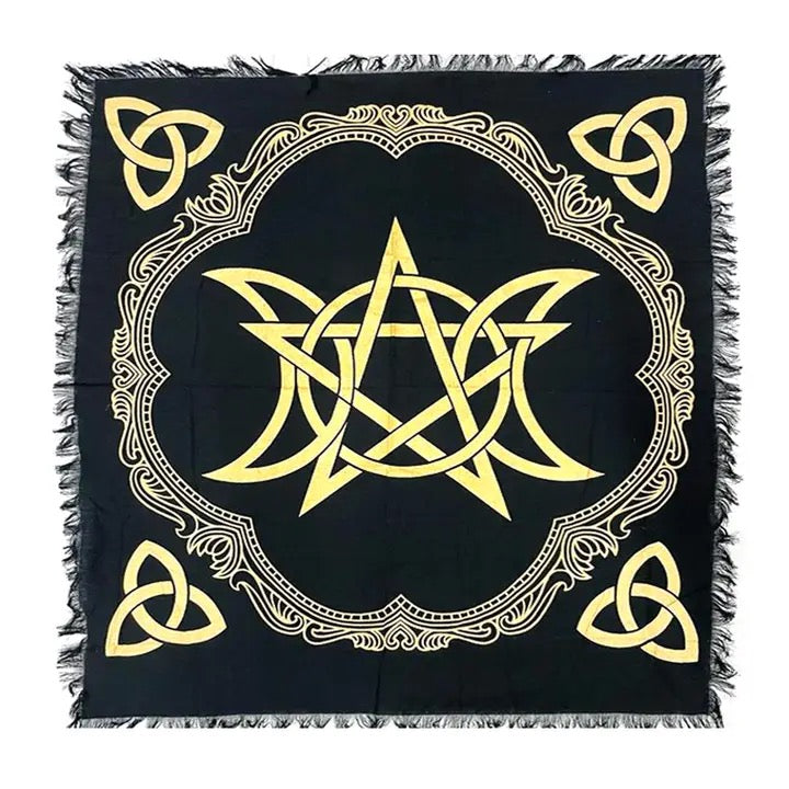 Black square cloth with gold geometric design and fringed edges