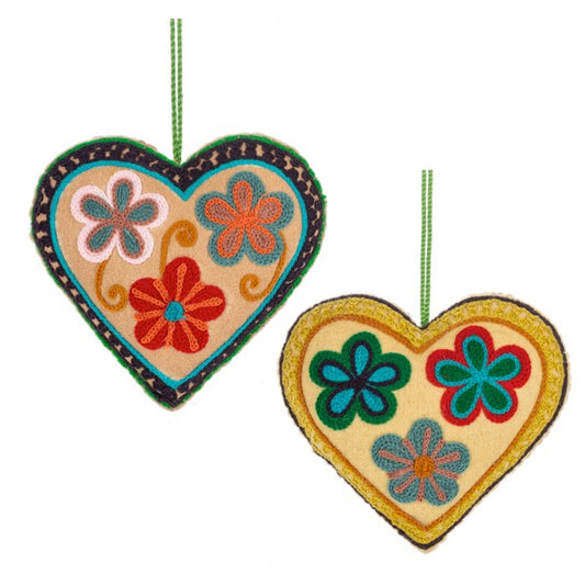 Two colorful heart-shaped decorations with floral patterns on a white background