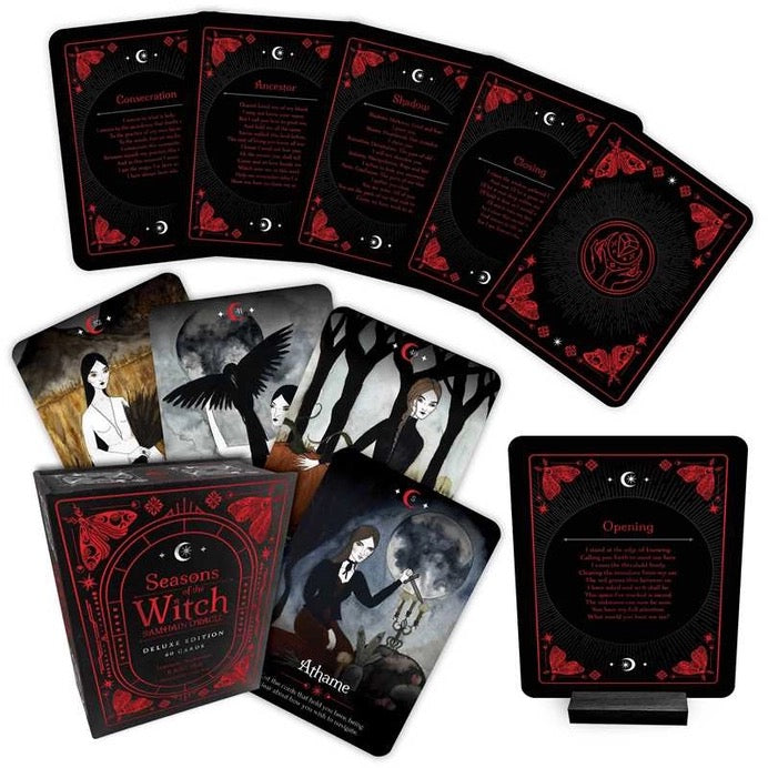 Witch-themed oracle deck set with the box, multiple illustrated cards fanned out, and a standalone card stand on a white background.