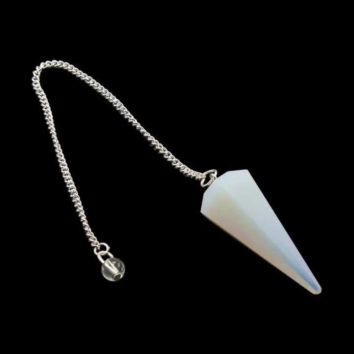 White pendulum on a black background