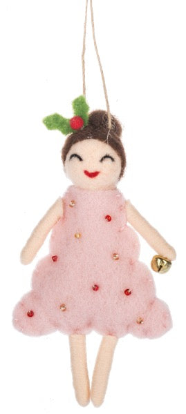 Felted doll ornament with pink dress and holly leaves on a white background