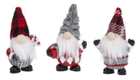 Three festive gnomes with plaid hats on a white background