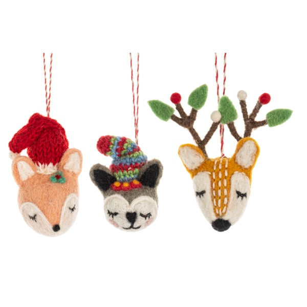 Three knitted animal ornaments on a white background