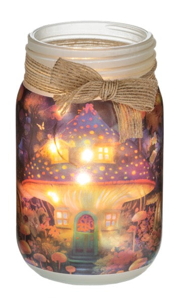 Mason jar with fairy tale mushroom design and light inside on a white background