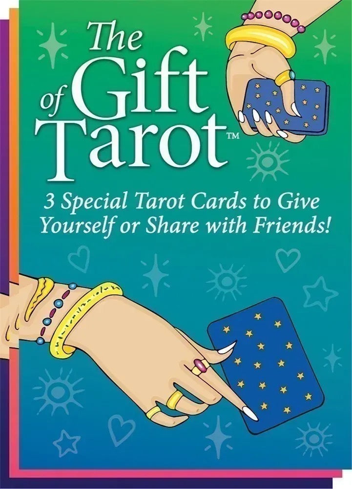 Front cover of 'The Gift of Tarot' card deck, featuring illustrated hands holding blue tarot cards against a teal-to-blue gradient background with white title text and decorative star/heart motifs.
