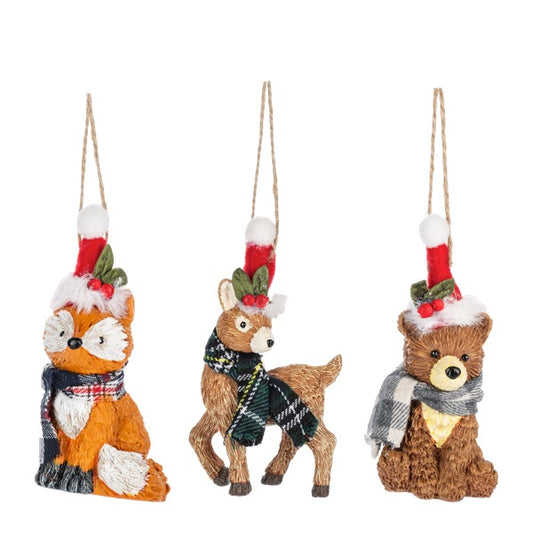 Set of three festive animal ornaments including a fox, deer, and bear, each wearing a scarf and hat on a white background.