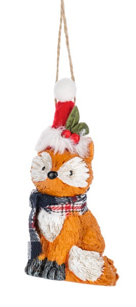Fox ornament with plaid scarf and red hat hanging on a white background