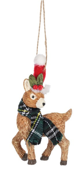 Decorative deer ornament with a tartan scarf and red holly berries on a white background