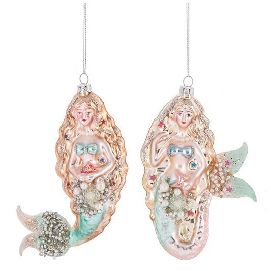 Two decorative mermaid ornaments on a white background