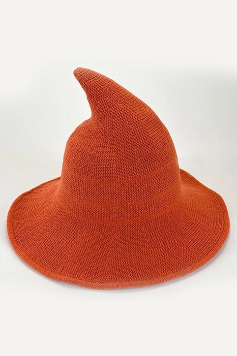 Orange witch hat on a white background