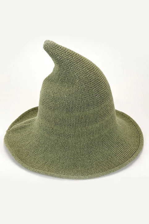 Green knitted witch hat on a white background