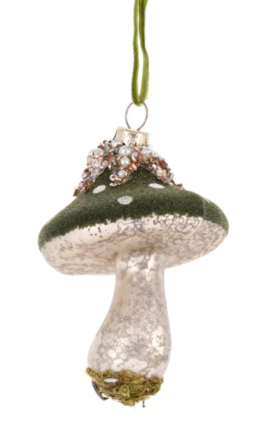 Decorative mushroom ornament with green cap and silver stem on a white background