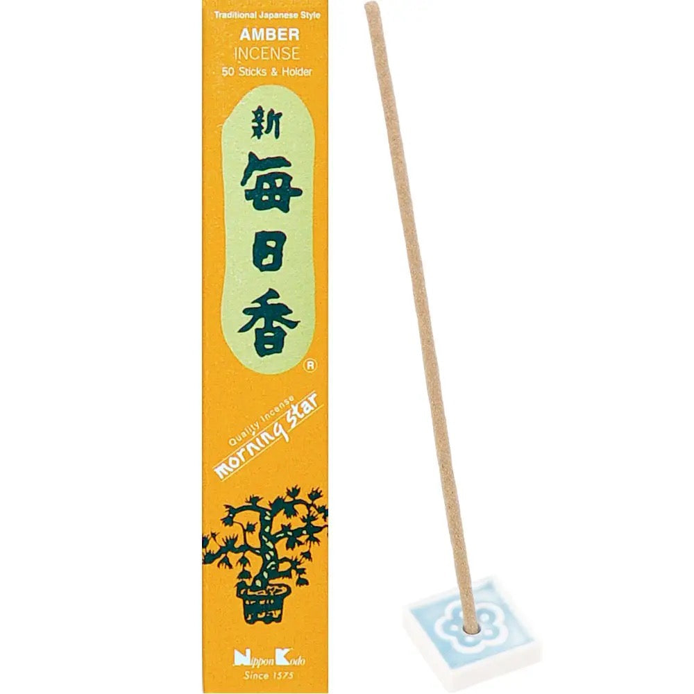 Amber incense stick with packaging on a white background